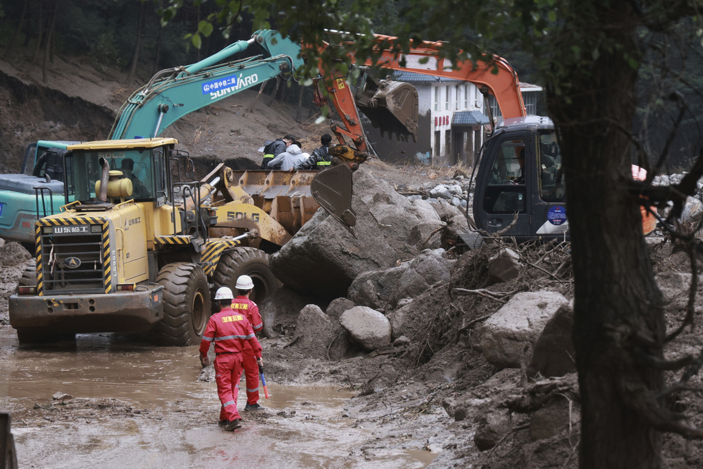 Flash floods kill at least 10 people and leave 33 missing in northwestern China Flash floods kill at least 10 people and leave 33 missing in northwestern China