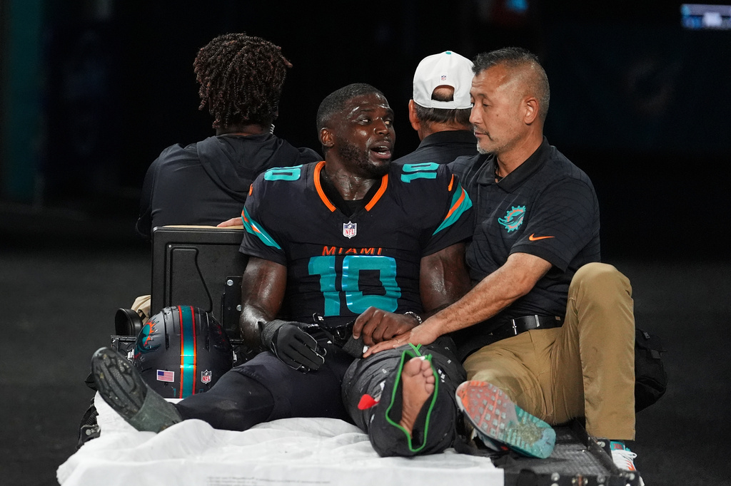 Dolphins’ Tyreek Hill carted off field and taken to hospital with dislocated left knee