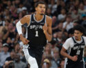 San Antonio Spurs center Victor Wembanyama (1) runs up-court during the second half of an NBA basketball game against the Toronto Raptors, Monday, Oct. 27, 2025, in San Antonio. (AP Photo/Darren Abate)