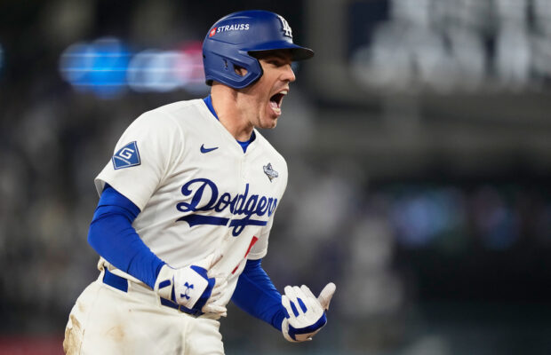 Los Angeles Dodgers' Freddie Freeman celebrates his walk off home run against the Toronto Blue Jays during the 18th inning in Game 3 of baseball's World Series, Monday, Oct. 27, 2025, in Los Angeles. (AP Photo/Brynn Anderson)