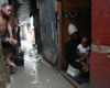People stay inside a shelter for families displaced by gang violence, flooded by rain brought by Hurricane Melissa, in Port-au-Prince, Haiti, Wednesday, Oct. 29, 2025. (AP Photo/Odelyn Joseph)