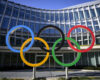 FILE -Olympic Rings are pictured in front of The Olympic House, headquarters of the International Olympic Committee (IOC) at the opening of the executive board meeting of the International Olympic Committee (IOC) in Lausanne, Switzerland, March 28, 2023. (Laurent Gillieron/Keystone via AP, File)