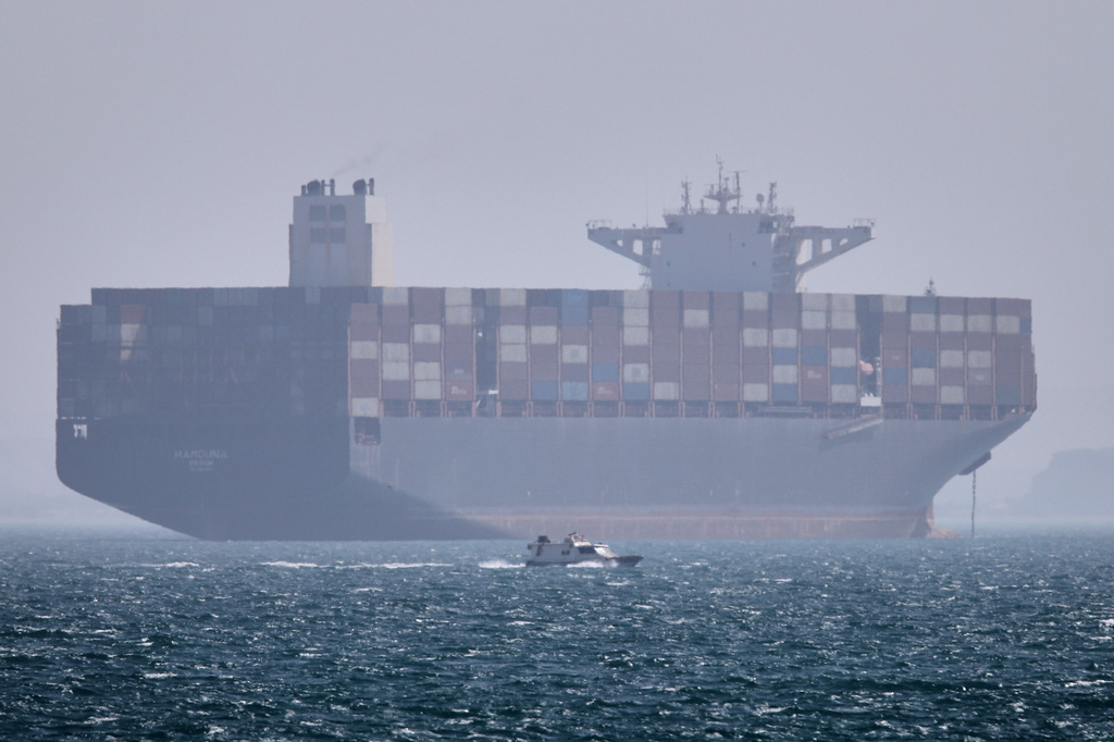 US claims progress in reopening the Strait of Hormuz, saying 2 merchant ships have transited