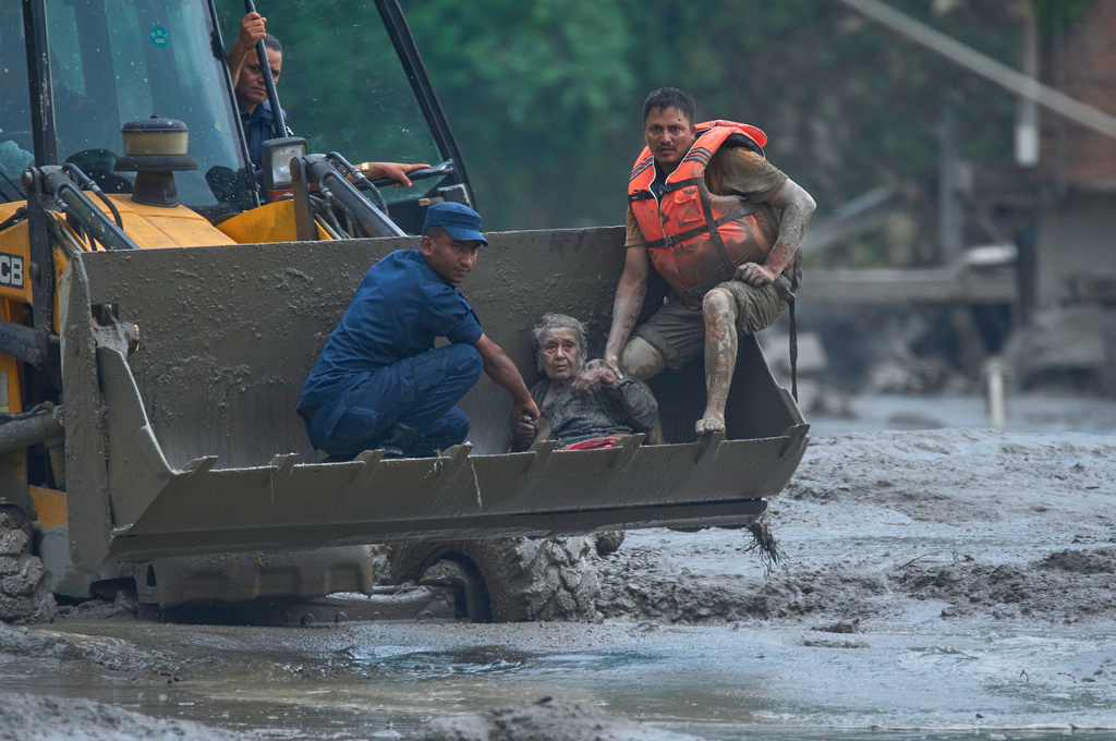 At least 160 killed and hundreds missing after flash floods in Nepal and China
